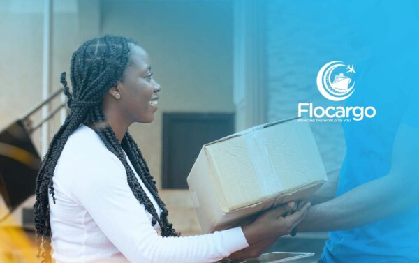 reliable-affordable-shipping-in-nigeria with client receiving parcel from flocargo agent