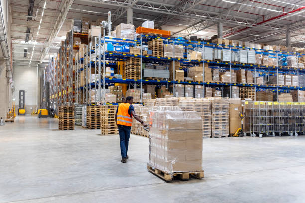 A customs officer inspecting a shipment, highlighting the importance of proper customs clearance for electronics.